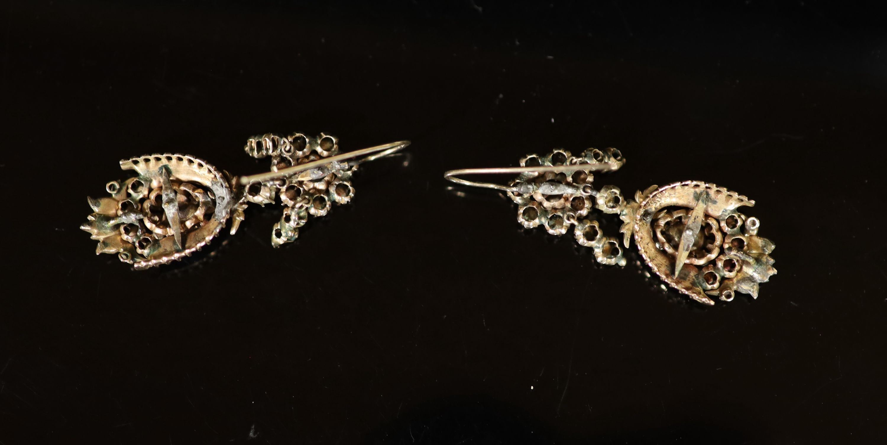 A pair of antique gold and rose cut diamond cluster set drop earrings